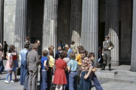 Iona Campagnolo standing with a group outside a building in East Germany