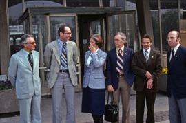 Iona Campagnolo standing with Roger Jackson and unknown men in East Germany