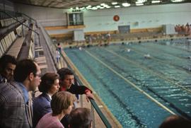 Iona Campagnolo watching sports activity at a swimming pool in East Germany