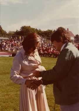 Iona Campagnolo shaking hands with man at ceremony