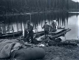 Swannell moving camp with raft on Thutade Lake