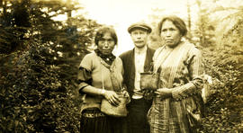 Unidentified indigenous women picking berries with "Jack"