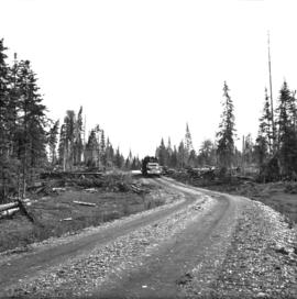 Loaded logging truck on way to log dump on Eagle Lake on East Loop Road, Aleza Lake Forest Experiment Station