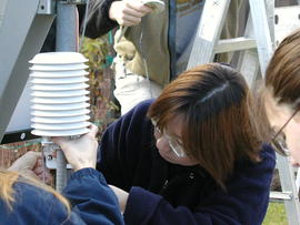 Students installing weather monitoring equipment