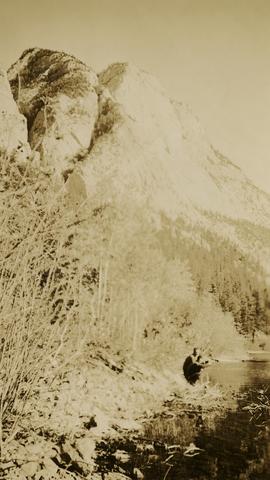 Jack Lee and Gordon Wyness drinking by a lake in Marble Canyon