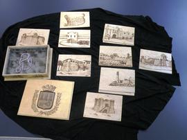 Wooden box with pyrographic etching, containg nine wooden plates with pyrographic etchings of historic landmarks in Havana, Cuba