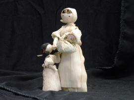 Corn husk figurines of woman and child