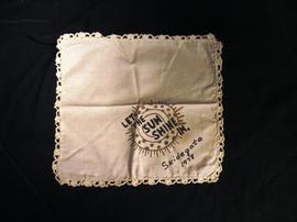 Skidegate handkerchief with words "Let the sun shine in Skidegate 1978"