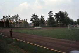 Sports field in Germany with unknown man on running track