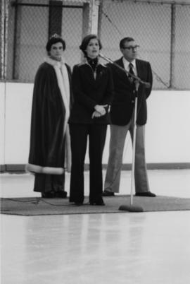 Iona Campagnolo announcing winner of beauty pageant in an ice rink