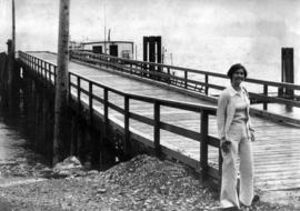 Iona Campagnolo posing by a wharf in Skeena