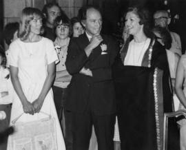 Iona Campagnolo wearing a button blanket with Pierre Trudeau and students at the House of Commons