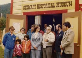 Iona Campagnolo with John C. Lundquist and others in front of the Stewart Historical Museum