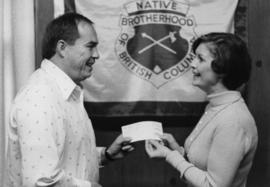 Iona Campagnolo presenting cheque to director of the Native Brotherhood of British Columbia