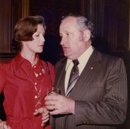 Iona Campagnolo standing with Eugene Whelan, Minister of Agriculture