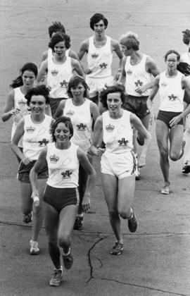 Youth track teams running and wearing Edmonton 1978 shirts