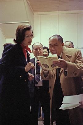 Iona Campagnolo and Earl Mah reading a chinese book