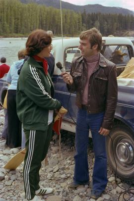 Iona Campagnolo being interviewed by man with microphone at Kitimat Delta King Days