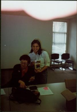 Bridget Moran with Woman holding copy of 'Judgement at Stoney Creek'