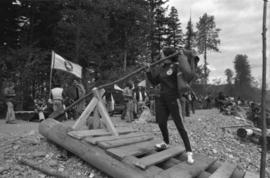 Iona Campagnolo tests rudder on raft at Kitimat Delta King Days raft race event