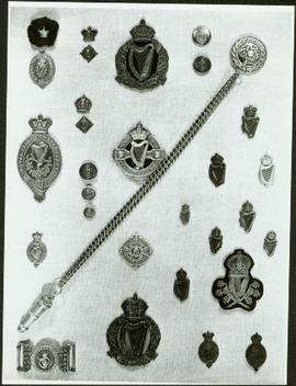 Close-up of Royal Irish Constabulary badges, buckle and whistle chain