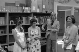 Iona Campagnolo standing with Ann Marie Santos, Estelle Berube, and Bernd Guderjahn in Cassiar High School library