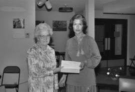 Iona Campagnolo and a woman hold a letter