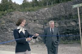 Iona Campagnolo cutting ribbon and Joe Scott at opening ceremony for Scott Road Highway opening in Prince Rupert