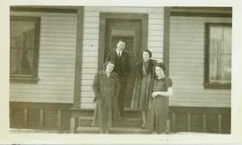 Dr. and Mrs. Austen standing with two unidentified women