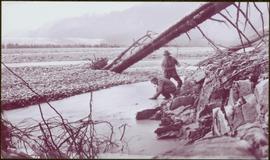 Taku River Survey - Two Men Standing in Shallow River