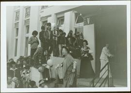 Iona Campagnolo and many unidentified children and adults watching Muriel Brown’s performance as ...