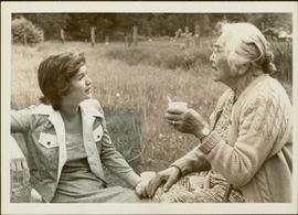 Iona Campagnolo talking to Agnes Sutton in a field at Usk, 1974