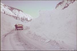 Unidentified Man and Truck by Snowbanks on Highway 16, ca. 1976