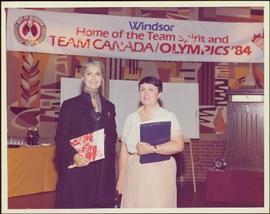Minister Iona Campagnolo stands beside unidentified woman during the Windsor-Detroit bid for the 1984 Olympics, Windsor, ON