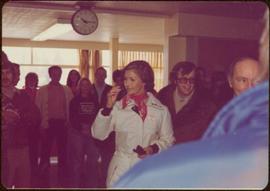 Iona Campagnolo and Prime Minister Pierre Trudeau indoors, surrounded by a crowd at the Northern BC Winter Games, Prince George, Winter 1978