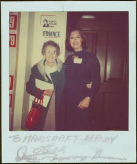 Margaret Main and Iona Campagnolo pose together in hallway