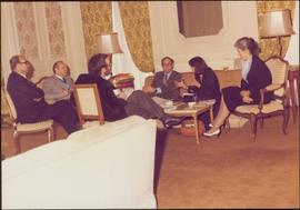 Paris Press Conference - Roger Jackson, Iona Campagnolo, and four unidentified others sit talking around coffee table