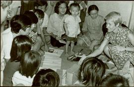 CUSO Mission, North-eastern Thailand - Unidentified group kneels on floor