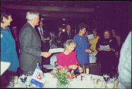 Iona Campagnolo and Liberal Party Leader John Turner in crowded banquet hall at a Four Seasons Hotel