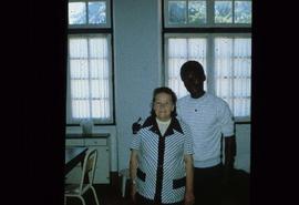 Unidentified woman and young man in a classroom at overseas location