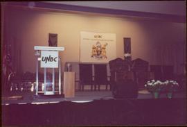 Ceremonial chairs onstage in front of UNBC banners, May 1994