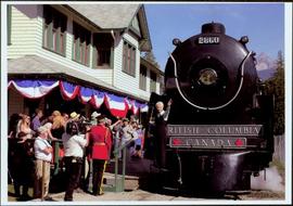 Lieutenant Governor Iona Campagnolo waving from the engine of a train while crowd looks on at Sti...