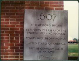 Plaque on brick wall, entitled “1607, At Jamestown began:"