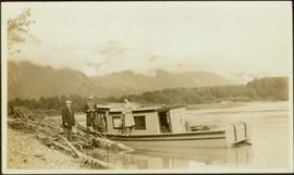 Joyce Collison, Tom Moorhouse, medical officer & unidentified man by boat on Nass River, BC