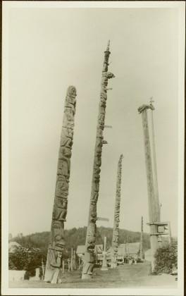 Totem and Mortuary Poles in an unidentified village