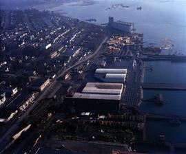 Aerial view of asbestos warehouse and wharf in proximity to residential area