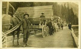 Convoy of carriages going over a bridge in Stewart, BC