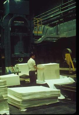Pulpmill - General - Man working with stacked paper