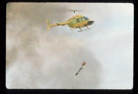 Woods Division - Fire - Slashburn - Helicopter carrying fire ignition device