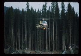 Woods Division - Fire - Helicopter hauling fire ignition device